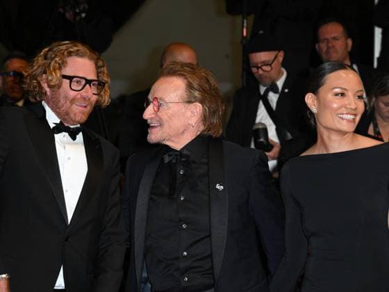 Cannes, 78th Cannes Film Festival 2025 - Evening 4 - Red Carpet of the Film Bono: Stories of Surrender Cannes, 78th Cannes Film Festival 2025 - Evening 4 - Red Carpet of the Film Bono: Stories of Surrender . In the Photo Erik Messerschmidt, Bono, Kelly McNamara and Jon Kamen Cannes France  Copyright: xIPA ABACAx