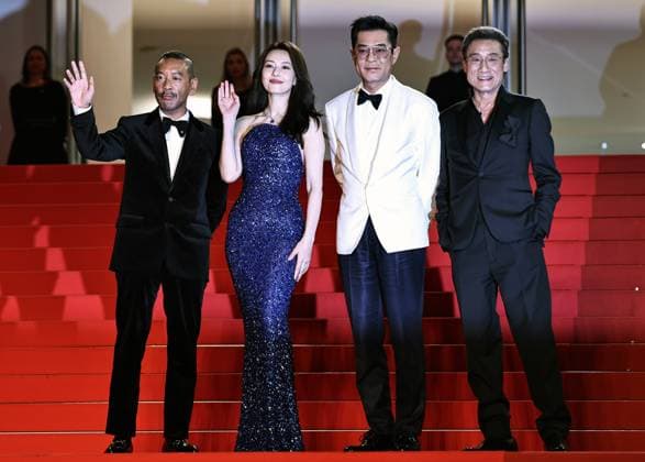 (250517) -- CANNES, May 17, 2025 -- Main cast members Tony Leung Ka Fai, Louis Koo, Gao Yuanyuan and director, screenwriter and producer Juno Mak (R-L) arrive for the premiere of the film Fung Lam Fo Saan (Sons of the Neon Night) at the 78th edition of the Cannes Film Festival in Cannes, southern France, on May 16, 2025. ) FRANCE-CANNES-FILM FESTIVAL- FUNG LAM FO SAAN -PREMIERE GaoxJing 