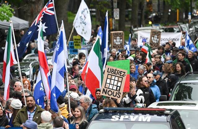May 19, 2025, Montreal, Pq, Canada: People take part in a march to celebrate National Patriots Day in Montreal, Monday, May 19, 2025. Montreal Canada  - ZUMAc35_ 20250519_zaf_c35_009 Copyright: xGrahamxHughesx