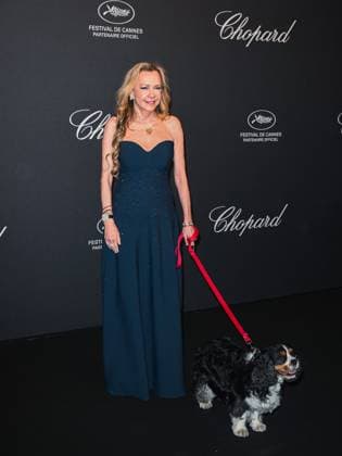 Cannes, Italy: Cannes, 78th Cannes Film Festival 2025 - evening 7 - Chopard Universe Dinner 2025 - In the photo: Caroline Scheufele with her dog Cannes Italy  - ZUMAp169 20250519_zea_p169_2088 Copyright: xSimonexComix