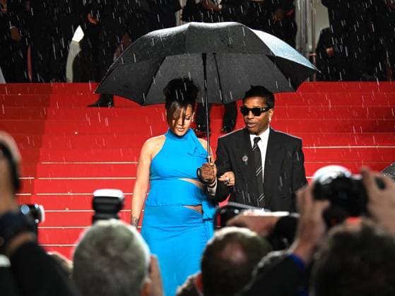 Cannes, 78th Cannes Film Festival 2025 - evening 7 - Asap and Rihanna Under Umbrella Cannes, 78th Cannes Film Festival 2025 - evening 7 - Red Carpet of the film Highest 2 Lowest . In the photo Asap Rocky (A Rocky) and Rihanna Cannes France  Copyright: xIPA ABACAx