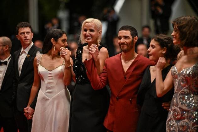 Cannes Alpha Screening JR Louai El Amrousy, Emma Mackey, Mélissa Boros, Julia Ducournau, Arnaud Chautard, Tahar Rahim, Jean-Rachid Kallouche, Golshifteh Farahani, Nicolas Altmayer, Finnegan Oldfield and Éric Altmayer attending the screening of Alpha at 78th Cannes Film Festival in Cannes, France on May, 19, 2025. Photo by Julien Reynaud APS-Medias ABACAPRESS.COM Cannes France  Copyright: xReynaudxJulien APS-Medias ABACAx