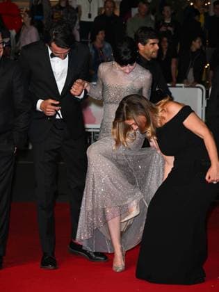 Cannes, 78th Cannes Film Festival 2025 - Evening 8 - Red Carpet Accident, Matilda De Angelis Gets Stuck in Her Heel Cannes, 78th Cannes Film Festival 2025 - Evening 8 - Red Carpet of the film Fuori . In the photo Corrado Fortuna, Matilda De Angelis, Ippolita Di Majo Matilda s dress gets stuck with her heel, accident on the Red Carpet Cannes France  Copyright: xIPA ABACAx