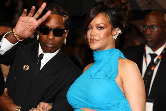 May 19, 2025, Cannes, France: A$AP ROCKY, 36, on the rainy carpet cradling his boo RIHANNA, 37, belly, with his chin resting on her shoulder on the La montà e des marches . Pregnant Barbadian Billionaire singer, actress, and businesswoman, showed off her growing baby bump in an electric-blue dress with strategic cutouts and a scarf tie at the neck and her styling partner American rapper wearing a black suit, black Ray-Bans and a full set of grillz to the premiere of the Spike directed film Premiere of Highest 2 Lowest , in which he co-stars opposite Denzel. Monday 7th day of the 78th Annual Cannes Film Festival on the LE RED STEPS. Cannes France - ZUMAc179 20250519_zep_c179_376 Copyright: xMickaelxChavetx