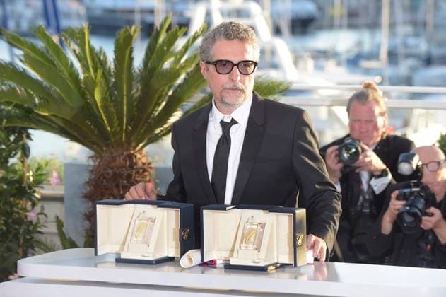 Kleber Mendonca Filho poses with the FIPRESCI Award (Competition) and the Best Director Award for The Secret Agent during the Palme D Or winners photocall at the 78th annual Cannes Film Festival at Palais des Festivals in Cannes, France on Saturday, May 24, 2025.  CAN20250524125 RoccoxSpaziani