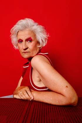 Creative Highlights Symbolbilder Woman with white hair and makeup posing against a red background model released, Symbolfoto, TCEF02458
