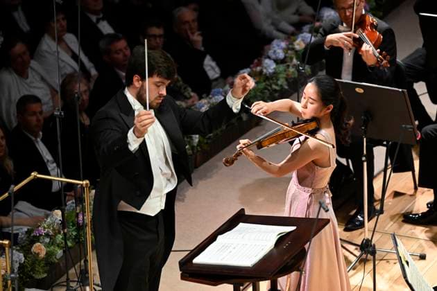 Japanese violinist Tsukushi Sasaki, right, performs at the Prague Radio Symphony Orchestra concert under Czech conductor Jan Sedlacek, left, during the Prague Spring International Music Festival on 28 May 2025, Prague, Czech Republic. (CTKxPhoto KaterinaxSulova) CTKPhotoP2025052809819  CTKPhotoP2025052809819