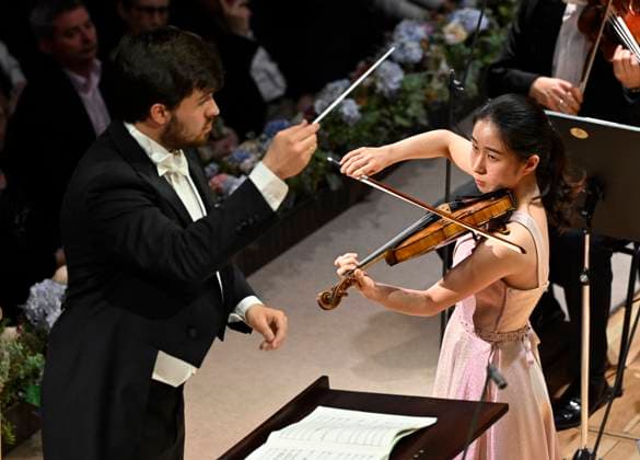 Japanese violinist Tsukushi Sasaki, right, performs at the Prague Radio Symphony Orchestra concert under Czech conductor Jan Sedlacek, left, during the Prague Spring International Music Festival on 28 May 2025, Prague, Czech Republic. (CTKxPhoto KaterinaxSulova) CTKPhotoP2025052809820  CTKPhotoP2025052809820