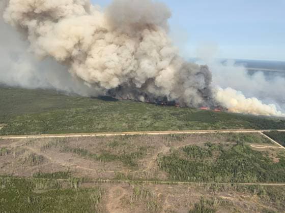 (250529) -- MANITOBA, May 29, 2025 -- An aerial drone photo taken on May 27, 2025 shows a wildfire near Wanless, Manitoba, Canada. Manitoba, one of Canada s three Prairie Provinces, declared on Wednesday a state of emergency due to extreme wildfire conditions and threats. ( Handout via Xinhua) CANADA-MANITOBA-WILDFIRE ManitobaxGovernment 