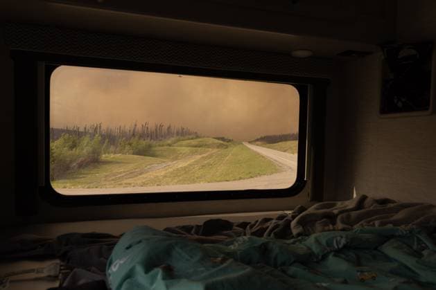 May 30, 2025, Buckinghorse River, Bc, Canada: Wildfire smoke is seen on Highway 97 north of Buckinghorse River, B.C. on Friday, May 30, 2025. Buckinghorse River Canada  - ZUMAc35_ 20250530_zaf_c35_198 Copyright: xNasunaxStuart-Ulinx