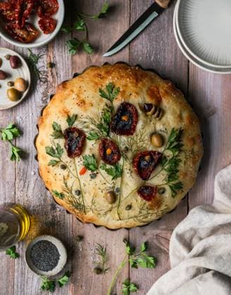 Top view baked focaccia bread decorated with flower design. Kingston, Ontario, Canada CR_DOHO250526D-1742607-01