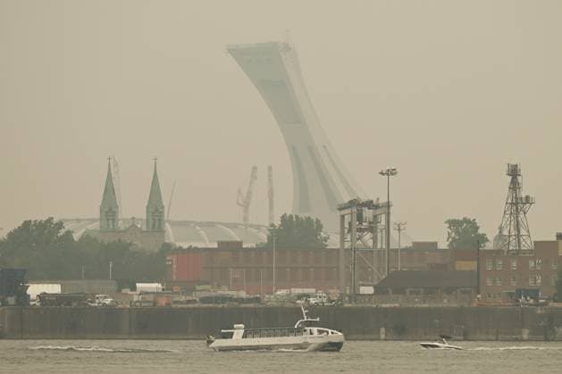 Wildfire Smoke Makes Montreal And Toronto Worst Cities For Air Quality MONTREAL, CANADA - JUNE 6: A view of Montrà al s harbour area with Olympic Stadium in the background, obscured by travelling wildfire smoke, in Montreal, Quebec, Canada, on June 6, 2025. As hundreds of wildfires rage across Canada, drifting smoke has triggered emergency evacuations, power outages, and air quality alerts in Ontario, Quà bec, and parts of the U.S., with Montreal ranking as the second most polluted city in the world on June 6, ahead of Delhi and Santiago, and Toronto placing fourth, according to IQAir. Montreal Canada Copyright: xSTRx originalFilename: str-wildfire250606_npnFg.jpg