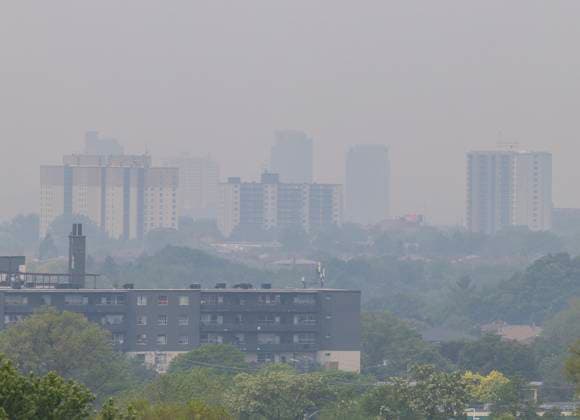 (250606) -- TORONTO, June 6, 2025 -- Buildings are shrouded in smoke from wildfire in Toronto, Canada, on June 6, 2025. Smoke from wildfires burning in northern Ontario and the Prairies of Canada caused poor air quality and reduced visibility in major cities including Toronto, Ottawa and Montreal on Friday. (Photo by Xinhua) CANADA-TORONTO-WILDFIRE-SMOKE-POOR AIR QUALITY ZouxZheng 
