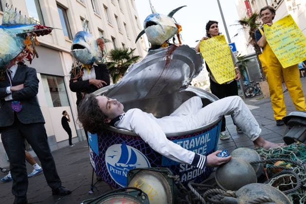June 8, 2025, Nice, England, France: On World Oceans Day, Ocean Rebellion activists staged a theatrical protest outside a Monoprix supermarket in Nice, France, to spotlight concerns over industrial tuna fishing practices. The demonstration featured performers unveiling a giant can of Petit Navire tuna containing a Ã¢â‚¬Ëœdead sailorÃ¢â‚¬â ¢, accompanied by a satirical rendition of the French song Ã¢â‚¬ËœIl o°tait un Petit NavireÃ¢â‚¬â ¢. The protest aimed to draw attention to alleged human rights abuses and environmental impacts associated with tuna fisheries, particularly those linked to the Marine Stewardship CouncilÃ¢â‚¬â ¢s certification processes and the sourcing practices of global seafood companies. This action coincided with the - ZUMAp242 20250608_zip_p242_014 Copyright: xJoaoxDanielxPereirax