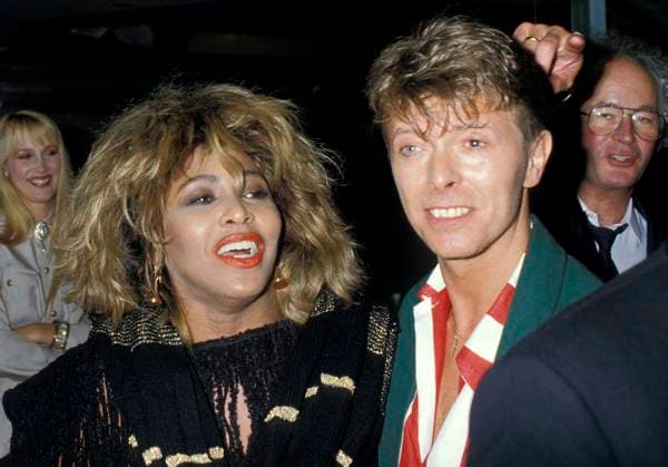 Archivbilder der Woche KW24 TINA TURNER & DAVID BOWIE London, England, Circa 1985 headshot portrait red lips lipstick red white stripe shirt green jacket eighties 80 s CAP PL Phil Loftus London Great Britain Copyright: xPhilxLoftus CapitalxPicturesx