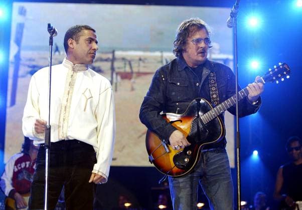Music for Asia Charity Concert CHEB MAMI & ZUCCHERO Performs live at Music for Asia Charity Concert, Milan, Italy, March 21st 2005. half length sunglasses glasses on stage guitar Omega Milan Italy Copyright: xOmega CapitalxPicturesx