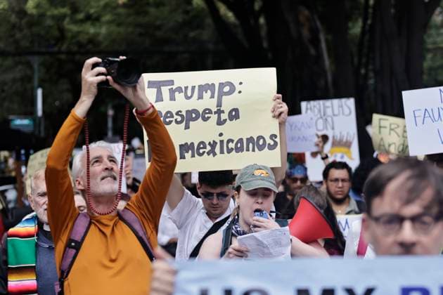 June 14, 2025, Mexico, Cdmx, Mexico: Not only in the Americas are protesting against President Donald Trump, but also abroad, a group of American citizens are taking to the streets of Mexico City toward the United States Embassy to show their disapproval and rejection of the recent violent actions, illegal deportations, and arrests against legal and illegal immigrants in Los Angeles and other sanctuary states. This anti-Trump demonstration is taking place on his birthday, to let him know that he is not a king, that they do not want tyrants, and that they will not celebrate the violence the Trump administration is inflicting on their own people. Mexico Mexico - ZUMAp204 20250614_zip_p204_063 Copyright: xJosuexPerezx