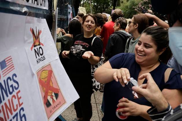 June 14, 2025, Mexico, Cdmx, Mexico: Not only in the Americas are protesting against President Donald Trump, but also abroad, a group of American citizens are taking to the streets of Mexico City toward the United States Embassy to show their disapproval and rejection of the recent violent actions, illegal deportations, and arrests against legal and illegal immigrants in Los Angeles and other sanctuary states. This anti-Trump demonstration is taking place on his birthday, to let him know that he is not a king, that they do not want tyrants, and that they will not celebrate the violence the Trump administration is inflicting on their own people. Mexico Mexico - ZUMAp204 20250614_zip_p204_025 Copyright: xJosuexPerezx