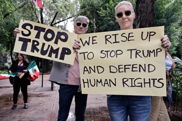June 14, 2025, Mexico, Cdmx, Mexico: Not only in the Americas are protesting against President Donald Trump, but also abroad, a group of American citizens are taking to the streets of Mexico City toward the United States Embassy to show their disapproval and rejection of the recent violent actions, illegal deportations, and arrests against legal and illegal immigrants in Los Angeles and other sanctuary states. This anti-Trump demonstration is taking place on his birthday, to let him know that he is not a king, that they do not want tyrants, and that they will not celebrate the violence the Trump administration is inflicting on their own people. Mexico Mexico - ZUMAp204 20250614_zip_p204_019 Copyright: xJosuexPerezx