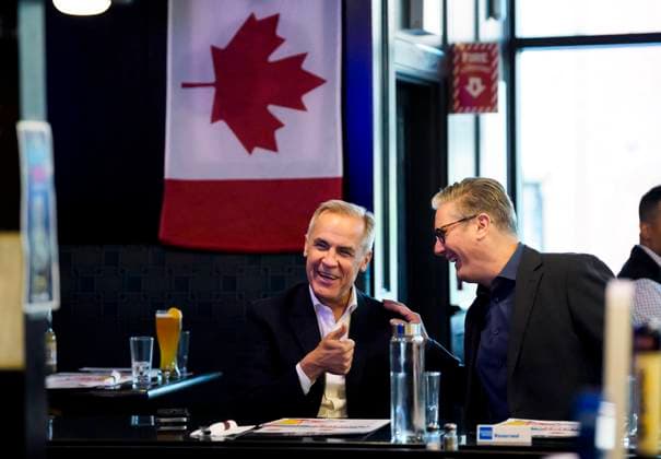 June 14, 2025, Ottawa, On, CAN: Prime Minister of Canada Mark Carney and Prime Minister of the United Kingdom Keir Starmer sit down to watch the Edmonton Oilers play the Florida Panthers in the NHL s Stanley Cup Final at a pub in Ottawa, on Saturday, June 14, 2025. Ottawa CAN  - ZUMAc35_ 20250614_zaf_c35_226 Copyright: xJustinxTangx