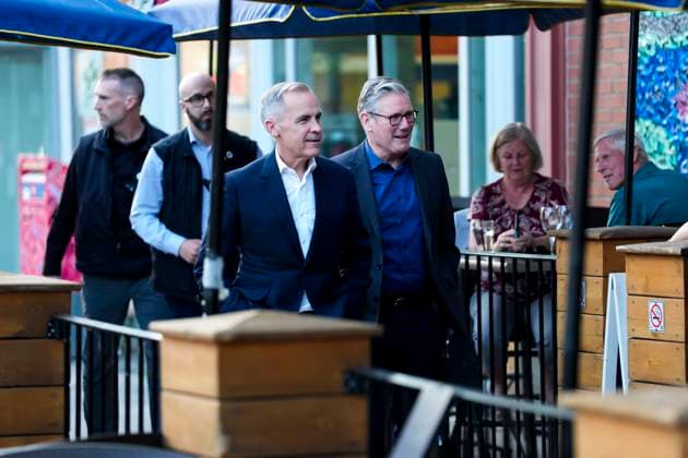 June 14, 2025, Ottawa, On, CAN: Prime Minister of Canada Mark Carney and Prime Minister of the United Kingdom Keir Starmer walk to a pub to watch the Edmonton Oilers play the Florida Panthers in the NHL s Stanley Cup Final, in Ottawa, on Saturday, June 14, 2025. Ottawa CAN  - ZUMAc35_ 20250614_zaf_c35_233 Copyright: xJustinxTangx