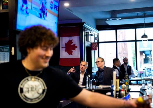 June 14, 2025, Ottawa, On, CAN: Prime Minister of Canada Mark Carney and Prime Minister of the United Kingdom Keir Starmer watch the Edmonton Oilers play the Florida Panthers in the NHL s Stanley Cup Final at a pub in Ottawa, on Saturday, June 14, 2025. Ottawa CAN  - ZUMAc35_ 20250614_zaf_c35_234 Copyright: xJustinxTangx