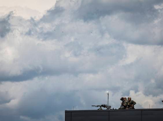 June 15, 2025, Calgary, Ab, CANADA: A security detail monitors the airport as delegates arrive in Calgary, Alta., Sunday, June 15, 2025, to attend the G7 Leaders meeting taking place in the nearby community of Kananaskis. Calgary CANADA  - ZUMAc35_ 20250615_zaf_c35_090 Copyright: xJeffxMcintoshx