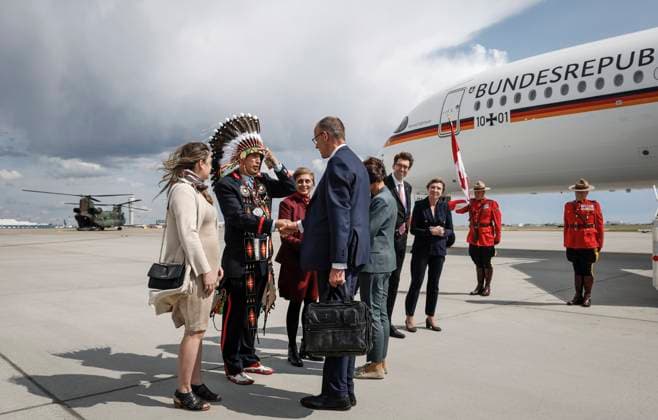 June 15, 2025, Calgary, Ab, CANADA: German Chancellor Friedrich Merz, centre, is greeted by Steven Crowchild, second left, of the Tsuut ina First Nation, as he arrives in Calgary, Alta., Sunday, June 15, 2025, to attend the G7 Leaders meeting taking place in Kananaskis. Calgary CANADA - ZUMAc35_ 20250615_zaf_c35_204 Copyright: xJeffxMcintoshx