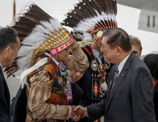 June 15, 2025, Calgary, Ab, CANADA: Japanese Prime Minister Shigeru Ishiba, right, is greeted by members of the Tsuut ina First Nation as he arrives in Calgary, Alta., Sunday, June 15, 2025, to attend the G7 Leaders meeting taking place in the nearby community of Kananaskis. Calgary CANADA - ZUMAc35_ 20250615_zaf_c35_218 Copyright: xJeffxMcintoshx