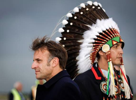 June 15, 2025, Calgary, Ab, CANADA: French President Emmanuel Macron, left, walks past after being greeted by Steven Crowchild, of the Tsuut ina First Nation as he arrives in Calgary, Alta., Sunday, June 15, 2025, to attend the G7 Leaders meeting taking place in the nearby community of Kananaskis. Calgary CANADA - ZUMAc35_ 20250615_zaf_c35_230 Copyright: xJeffxMcintoshx