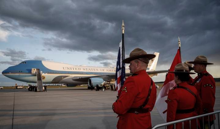 June 15, 2025, Calgary, Ab, CANADA: RCMP Mounties wait in front of Air Force One as U.S. President Donald Trump arrives in Calgary, Alta., Sunday, June 15, 2025, to attend the G7 Leaders meeting taking place in Kananaskis. Calgary CANADA  - ZUMAc35_ 20250615_zaf_c35_242 Copyright: xJeffxMcintoshx