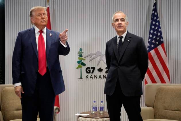 June 16, 2025, Kananaskis, Ab, Canada: Prime Minister Mark Carney, right, meets with United States President Donald Trump at the G7 Summit in Kananaskis, Alta., on Monday, June 16, 2025. Kananaskis Canada - ZUMAc35_ 20250616_zaf_c35_013 Copyright: xAdrianxWyldx