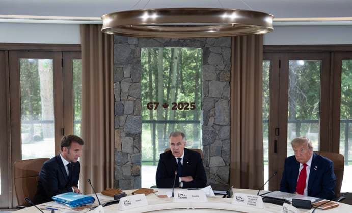 June 16, 2025, Kananaskis, Ab, Canada: French President Emmanuel Macron, left, and United States President Donald Trump, right, listen as Prime Minister Mark Carney delivers opening remarks at the first session at the G7 Summit in Kananaskis, Alta., on Monday, June 16, 2025. Kananaskis Canada - ZUMAc35_ 20250616_zaf_c35_047 Copyright: xAdrianxWyldx