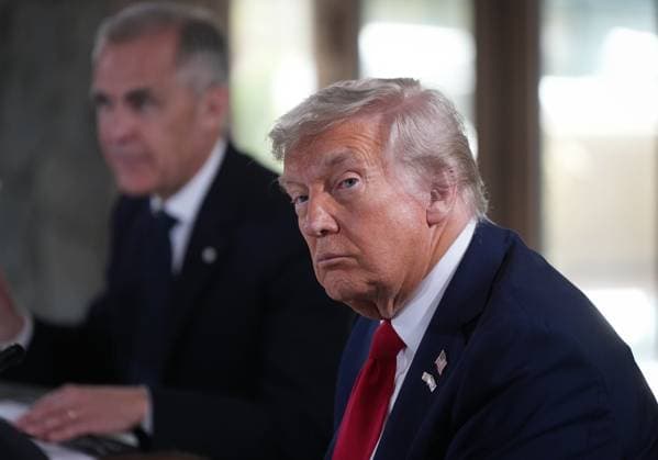 June 16, 2025, Kananaskis, Ab, CANADA: U.S. President Donald Trump, front right, listens to a question being shouted out by a reporter while seated next to Canadian Prime Minister Mark Carney, back left, during working session at the G7 Summit in Kananaskis, Alta., on Monday, June 16, 2025. Kananaskis CANADA - ZUMAc35_ 20250616_zaf_c35_086 Copyright: xDarrylxDyckx