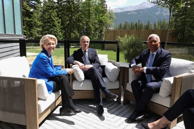 Canadian Prime Minister Mark Carney (C) speaks with European Commission President Ursula Von der Leyen (L), I, and European Council President António Costa (R) they meet during the Group of Seven (G7) Summit at the Pomeroy Kananaskis Mountain Lodge in Kananaskis, Alberta, Canada on Monday on June 16, 2025.  CAN2025061622 AlexandrosxMICHAILIDISx(EU)