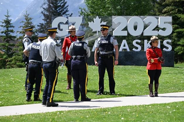 Activists Stage Symbolic Protests During G7 Meetings in Canada BANFF, CANADA – JUNE 16, 2025: A group of police officers stands near the G7 Summit logo displayed outside the International Media Center in Banff, Alberta, Canada, on June 16, 2025. Canada is hosting this year’s series of G7 meetings, which bring together the leaders of the world’s seven largest advanced economies. Artur Widak Anadolu Banff Canada. Editorial use only. Please get in touch for any other usage.  Copyright: x2025xAnadoluxArturxWidakx