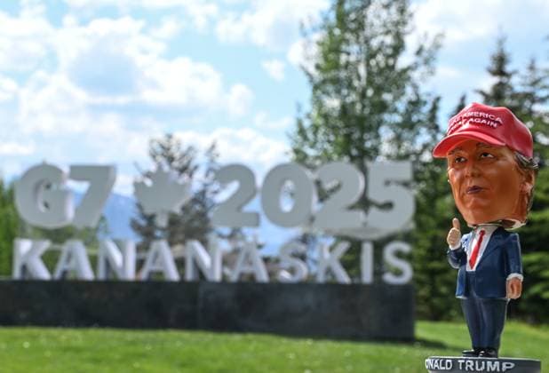 Trump™s Early Exit Throws G7 Summit Into Question BANFF, CANADA JUNE 17, 2025: A mini statue of U.S. President Donald Trump stands in front of the G7 Summit logo outside the International Media Center in Banff, Alberta, Canada, on June 17, 2025. President Trump left the G7 summit in Kananaskis, Canada, on Monday night a day and a half earlier than planned to return to Washington amid escalating tensions in the Middle East, raising questions about the future direction and outcomes of the ongoing talks. Banff Canada  Copyright: xSTRx originalFilename: str-trumpsea250617_npjaz.jpg