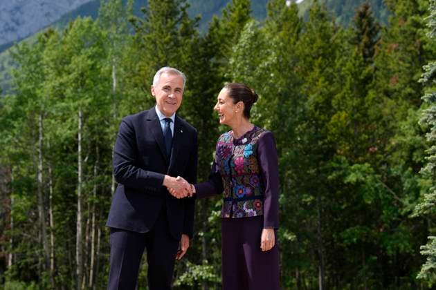 June 17, 2025, Kananaskis, Ab, Canada: Prime Minister Mark Carney greets Mexican President Claudia Sheinbaum at the G7 Summit in Kananaskis, Alta., on Tuesday, June 17, 2025. Kananaskis Canada  - ZUMAc35_ 20250617_zaf_c35_141 Copyright: xAdrianxWyldx