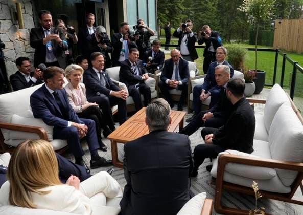 June 17, 2025, Kananaskis, Ab, Canada: Prime Minister Mark Carney speaks with leaders as they gather on a patio before a working session at the G7 Summit in Kananaskis, Alta., on Tuesday, June 17, 2025. Kananaskis Canada  - ZUMAc35_ 20250617_zaf_c35_091 Copyright: xAdrianxWyldx