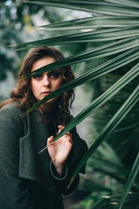 Creative Highlights Symbolbilder girl in a green coat in a greenhouse Poltava, Poltava Oblast, Ukraine R_DHLJFN210417C-716187-01 ,model released, Symbolfoto