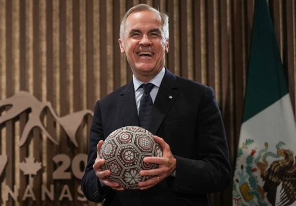 June 17, 2025, Kananaskis, Ab, CANADA: Canadian Prime Minister Mark Carney holds a soccer ball with beaded Huichol art on it after being gifted it by Mexican President Claudia Sheinbaum, not seen, before a meeting at the G7 Summit in Kananaskis, Alta., on Tuesday, June 17, 2025. Kananaskis CANADA - ZUMAc35_ 20250617_zaf_c35_336 Copyright: xDarrylxDyckx
