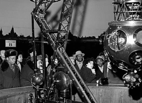 Students of Peoples Friendship University at USSR VDNKh 8934990 12.02.1961 Students from Asia, Africa and Latin America studying at the Peoples Friendship University in Moscow (now Patrice Lumumba Russian Peoples Friendship University) visit the USSR Exhibition of National Economic Achievements that showcases achievements of Soviet science and technology, including artificial satellites. Near the USSR Academy of Sciences Pavilion, there is a model of a container of the Vostok-L carrier rocket that brought the Luna-1 station to its flight trajectory on its flight to the Moon. Evgeniy Sputnik Moscow Russia  Copyright: xEvgeniyx