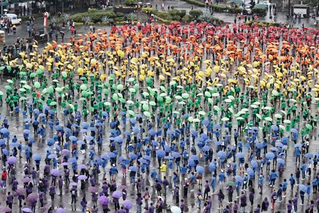 June 22, 2025, Mexico, Cdmx, Mexico: Hundreds of people gathered in Mexico City s Plaza de la ConstitucioÂ³n to break the record for the world s largest LGBTTTIQA+ flag. For this event, they used umbrellas in the same colors as the gay community flag. Mexico Mexico - ZUMAp204 20250622_zip_p204_008 Copyright: xJosuexPerezx