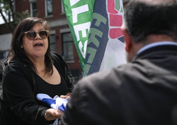 Woman With Israeli Flag Attacked During Edmonton Pro-Palestine Protest EDMONTON, CANADA JUNE 22: A woman carrying an Israeli flag is stopped by pro-Palestinian and Iranian protesters at the Hands Off Palestine, Iran, Syria, Yemen, Lebanon rally on White Avenue in Edmonton, where her flag is seized and thrown during the demonstration on June 22, 2025, in Edmonton, Alberta, Canada. Edmonton Canada Copyright: xArturxWidakx originalFilename: widak-womanwit250622_npsHp.jpg