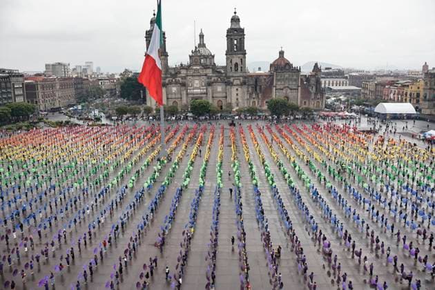 June 22, 2025, Mexico City, Mexico: Hundreds of people gathered in Mexico City s Plaza de la Constitucion to break the record for the world s largest LGBTTTIQA+ flag. For this event, they used umbrellas in the same colors as the gay community flag. Mexico City Mexico - ZUMAp204 20250622_zip_p204_028 Copyright: xJosuexPerezx