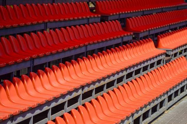 A row of red seats are empty. The seats are arranged in a row, w Chi?in?u, Chisinau, Moldova R_GGGP250618-1770180-01