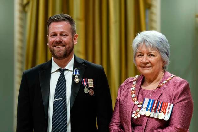 June 25, 2025, Ottawa, On, Canada: Sebastien Baillargeon of Cantley, Que., a diplomat and consular officer who helped the Canadian Armed Forces evacuate people as the Taliban took over Kabul, receives a Meritorious Service Cross from Gov. Gen. Mary Simon during a ceremony at Rideau Hall in Ottawa, on Wednesday, June 25, 2025. Ottawa Canada - ZUMAc35_ 20250625_zaf_c35_056 Copyright: xJustinxTangx