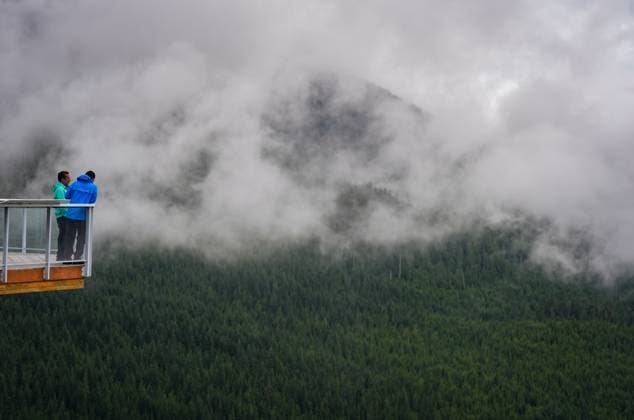 June 26, 2025, Squamish, Bc, CANADA: People stand at a lookout at the Sea-to-Sky Gondola in Squamish, B.C., on Thursday, June 26, 2025. The Squamish Nation and the provincial government have signed an agreement to guide forest stewardship in the nation s territory to protect cultural sites and environmentally sensitive areas from logging, new roads and tenures. The agreement establishes 33 cultural sites and six special cultural management areas. Squamish CANADA  - ZUMAc35_ 20250626_zaf_c35_026 Copyright: xDarrylxDyckx