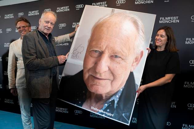 Christoph Gröner, Stellan Skarsgard and Julia Weigl at the presentation of the CineMerit Award at the 42 Filmfest München 2025 in the theater hall of the Amarikahaus Munich, 29 06 2025 Foto:xN.xKolinzx xFuturexImagex skarsgaard_5611