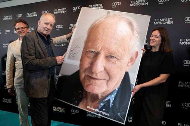 Christoph Gröner, Stellan Skarsgard and Julia Weigl at the presentation of the CineMerit Award at the 42 Filmfest München 2025 in the theater hall of the Amarikahaus Munich, 29 06 2025 Foto:xN.xKolinzx xFuturexImagex skarsgaard_5613